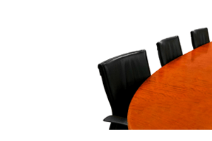 seats at a conference table for a board