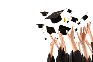 robed students throwing graduation hats in air