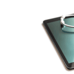 tablet with stethoscope on top