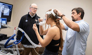 woman with breathing test apparatus on