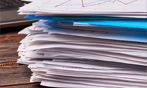 stacked papers and folders