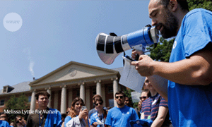 people protesting outside of academic building