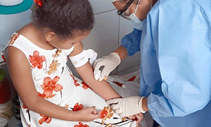 foreign child being treated by healthcare professional