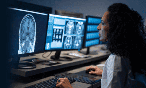 woman sitting at computer desk