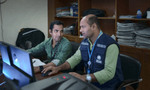 men working at computer